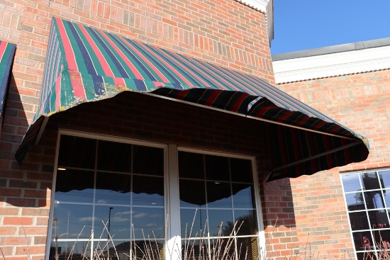 4' x 7' long aluminum framed awning - as is material on awning - buyer to r