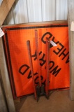 Metal road sign stand with 4' x 4' road work ahead sign