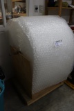 Roll of bubble wrap with wood portable base