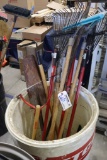 Barrel with contents - rakes and shovels
