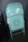Times 4 - Teal metal framed folding chairs
