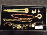 Group with Four Necklaces and Three Charms