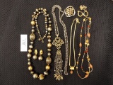 Group with Four Necklaces, 1 Brooch, & 3 Pairs of Clip On Earrings