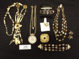Three Necklaces, Three Bracelets, 1 Brooch 1 Ring, and a pair of Clip On Ea