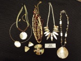 Five Necklaces and a Pair of Clip On Earrings All Accented with Mother of P