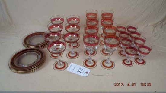 Cranberry and gold rimmed glass and plate set