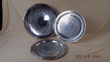 Three round silver plate platters