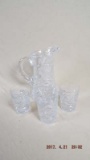 Cut crystal pitcher and 3 rocks glasses