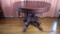 Round walnut pedestal table 40