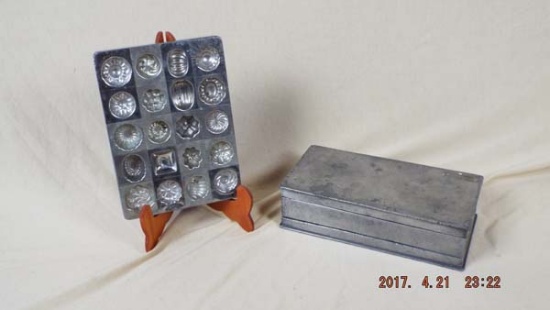 Group of molds including pewter butter mold