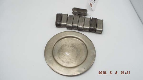 Group of pewter with 1 plate and 9 napkin rings