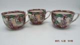 Three rose medallion like tea cups with handles,