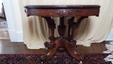 Oval marble top parlor table on casters