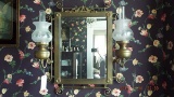 Brass mirror with oil lamps