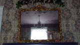 Gilded mirror shield & floral design
