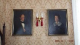 Pair of framed oil on canvas, somber portraits