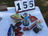 Group of old tin toys; large top, 3 fire truck, 3 play irons, tambourine, and more