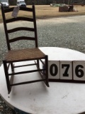 Child's rocking chair, wicker seat, seat is 15