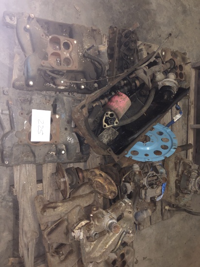 Pallet of intake manifolds, cams, oil pan, and carbs