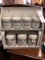 8 Piece Lot of Tin Condiment Canisters and Sugar, Coffee, and Tea in Wall Hanging Shelf