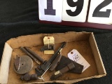 Assortment of old tools; including a hammer head, grinding wheel, pipe wrench, chisel, etc.