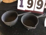 2 cast iron 3-footed pots, (1) marked No. 2, approx. 7/12