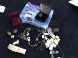 Assortment of necklaces, watch chains, earrings, bracelets, lemon slice squeezer, etc.