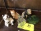 Group of Figurines; includes two kittens, glass dogs, porcelain lion, and green glass rabbit