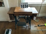 Singer Sewing Machine in Carved Oak Table, Four Side Drawers, Metal Legs and Pedal