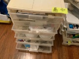 6-drawer plastic storage unit full of items such as glue, marking pens, lights, etc.