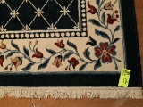 Blue wood rug 11' x 8.5' w/floral pattern border