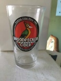 Group of 24 heavy beer glasses, imprinted WOODPECKER ENGLISH CIDER