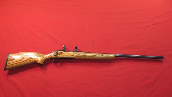 Remington 700 .223 bolt, laminated stock, heavy barrel, scope rings, blued