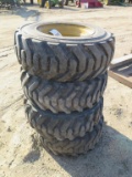 (4) Skid steer tires on rims 10x16.5, tag#3638