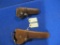 2- leather holsters, 6 & 10