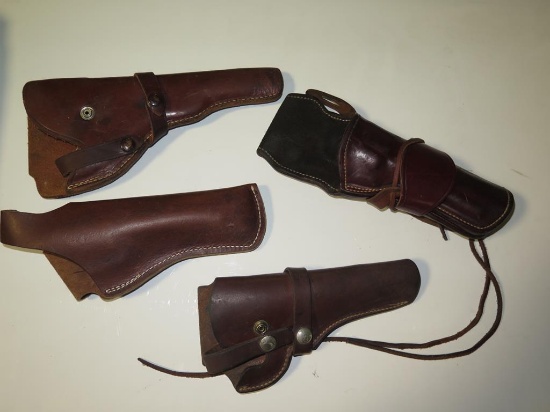 (4) Brown leather holsters, tag#6750