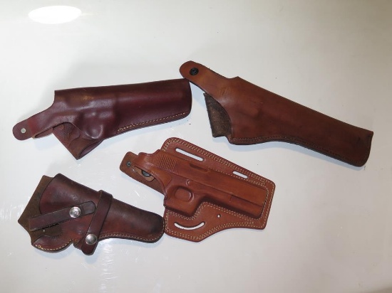 (4) Brown leather holsters, tag#6751