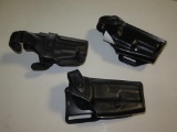(3) Black leather holsters, tag#6757
