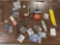 Group of fishing tools, new steel leaders, swivels, and advertising matchbo