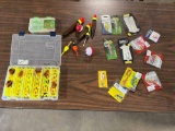 Group of new fishing lures, walleye spinners, Thill bobbers, and crappie lu