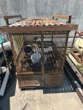 Metal cage with concrete pump accessories to include steel pipe, concrete pump hose, clamps,