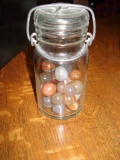 Glass jars with assorted glass marbles