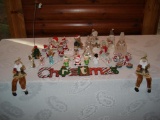 Assorted holiday figurines and Christmas Wall Hanging