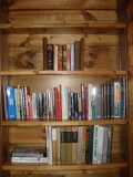 Assorted Books and Wooden Bookends