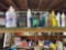 Top shelf of misc oils and work gloves