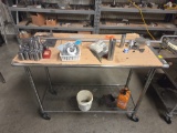 Rolling metal table with contents