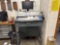 Standing desk with computer and contents