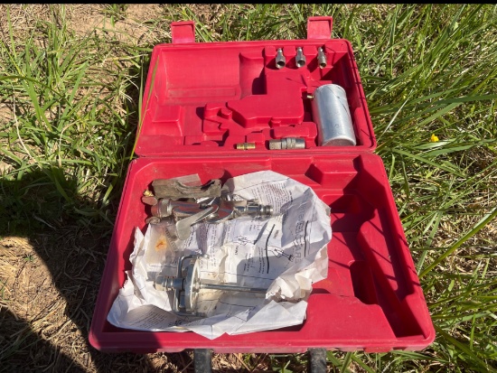 Plastic tool case with miscellaneous paint gun parts