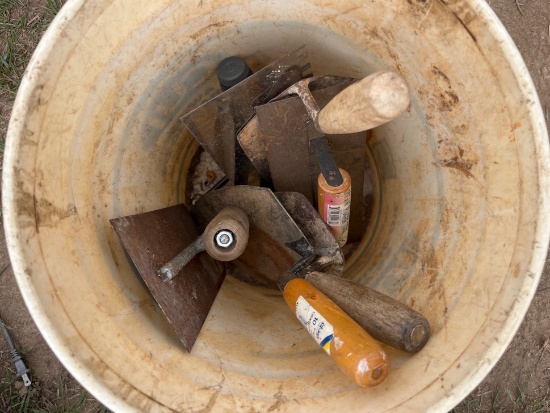 Bucket of concrete/masonry tools