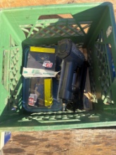 Craftsman nail gun with nails, wire brushes, and green crate